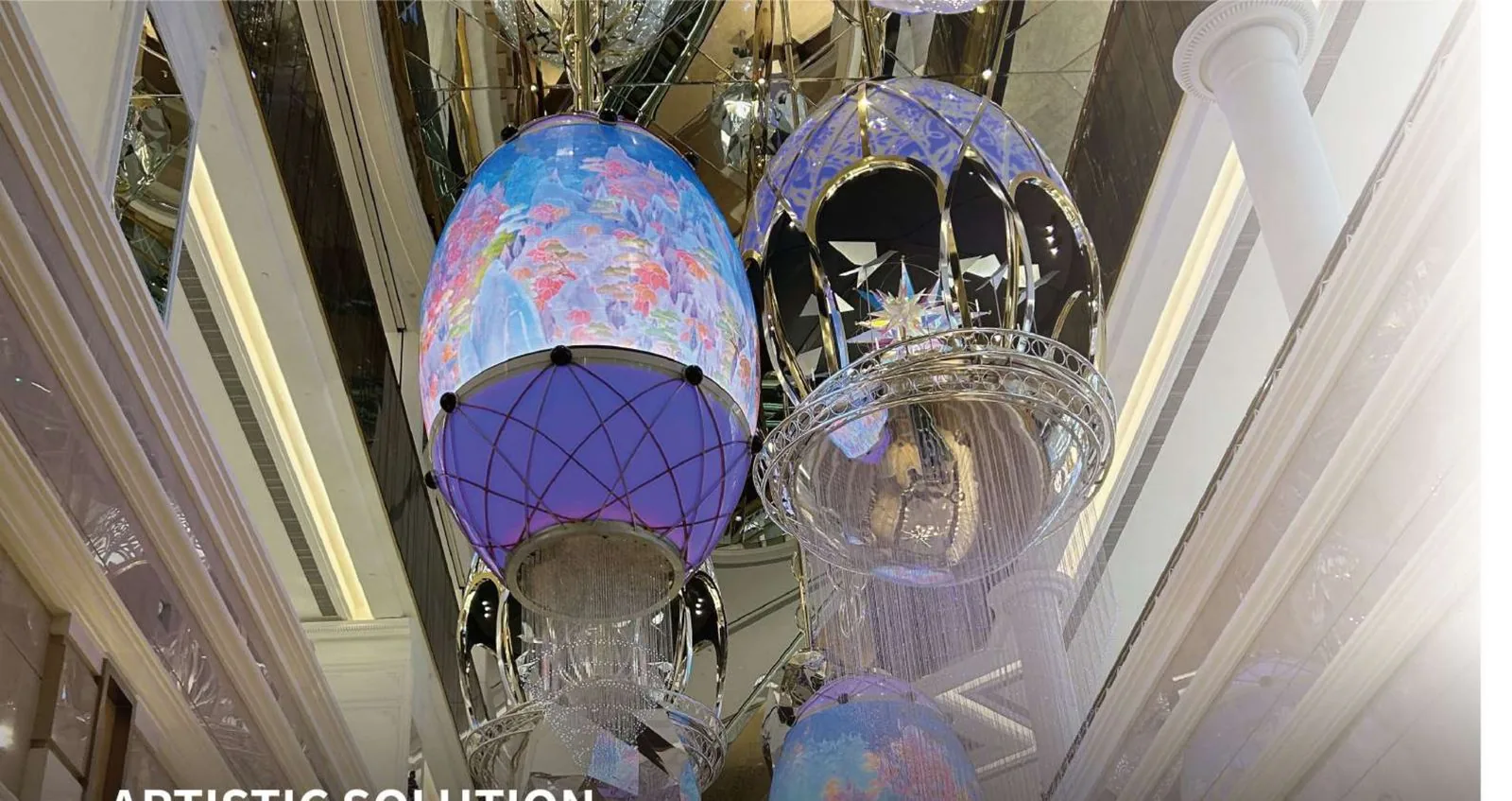 Cluster of LED sphere installations hanging in a mall atrium