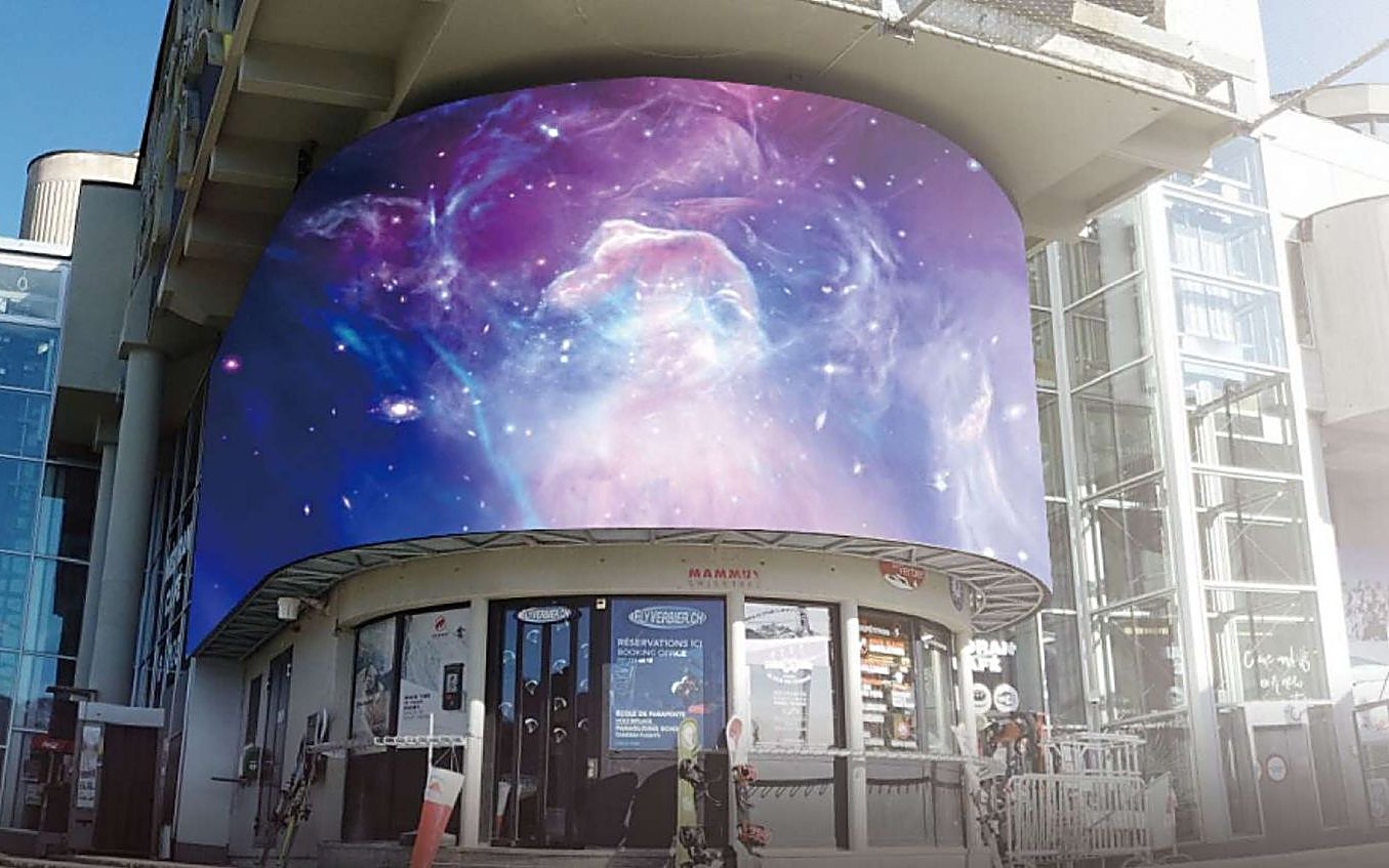 Curved LED wallscape on a commercial building