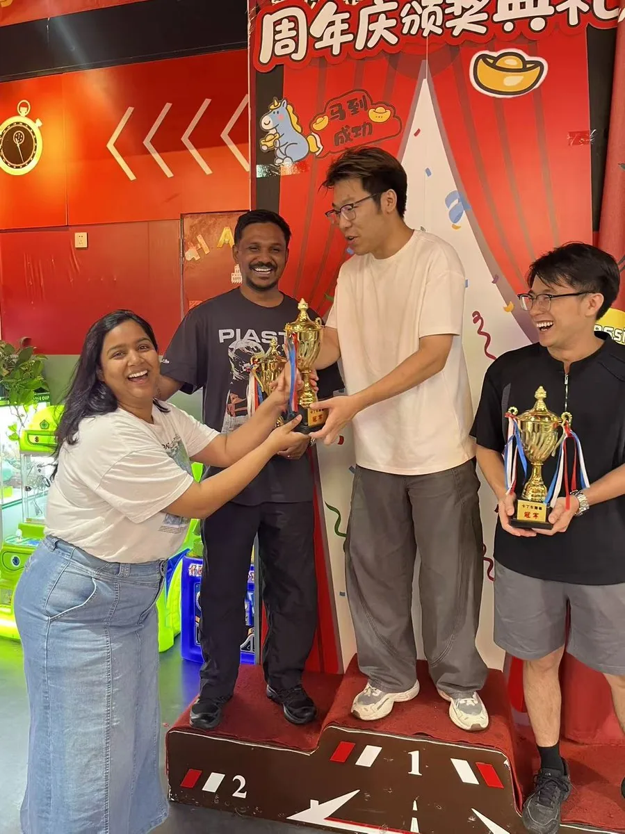 Celebrating a partnership milestone with trophies