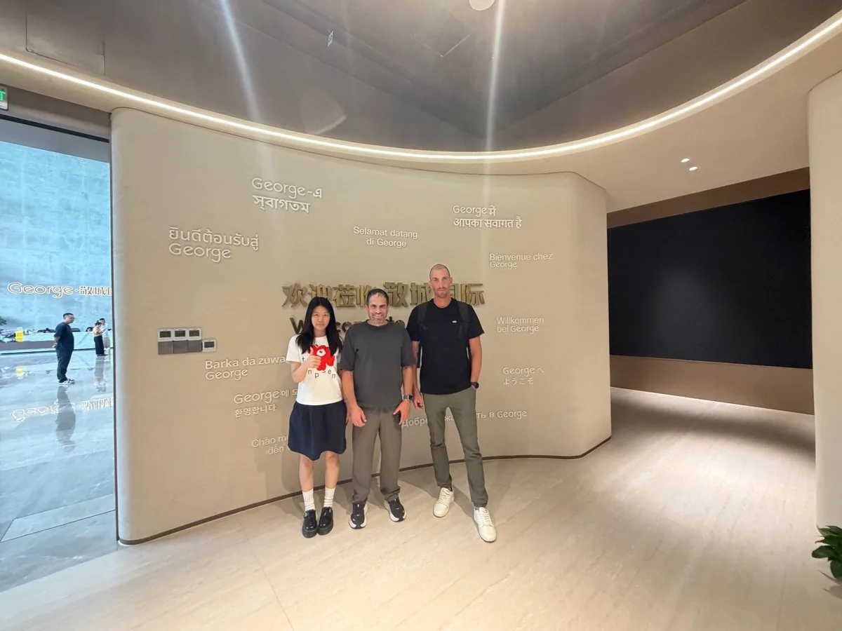 Guests at the multilingual welcome wall